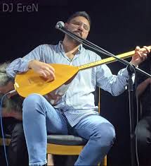 yüce dağ başinda üzüm kol atmiş